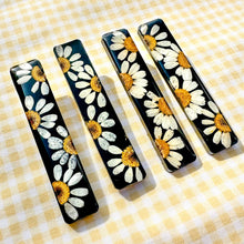 Load image into Gallery viewer, Black daisy bar hair clip