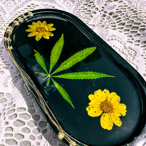 Oval goldeneye and cannabis leaf black tray