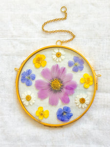 Cosmo, buttercup, daisy, & flax clock circle wall hanging