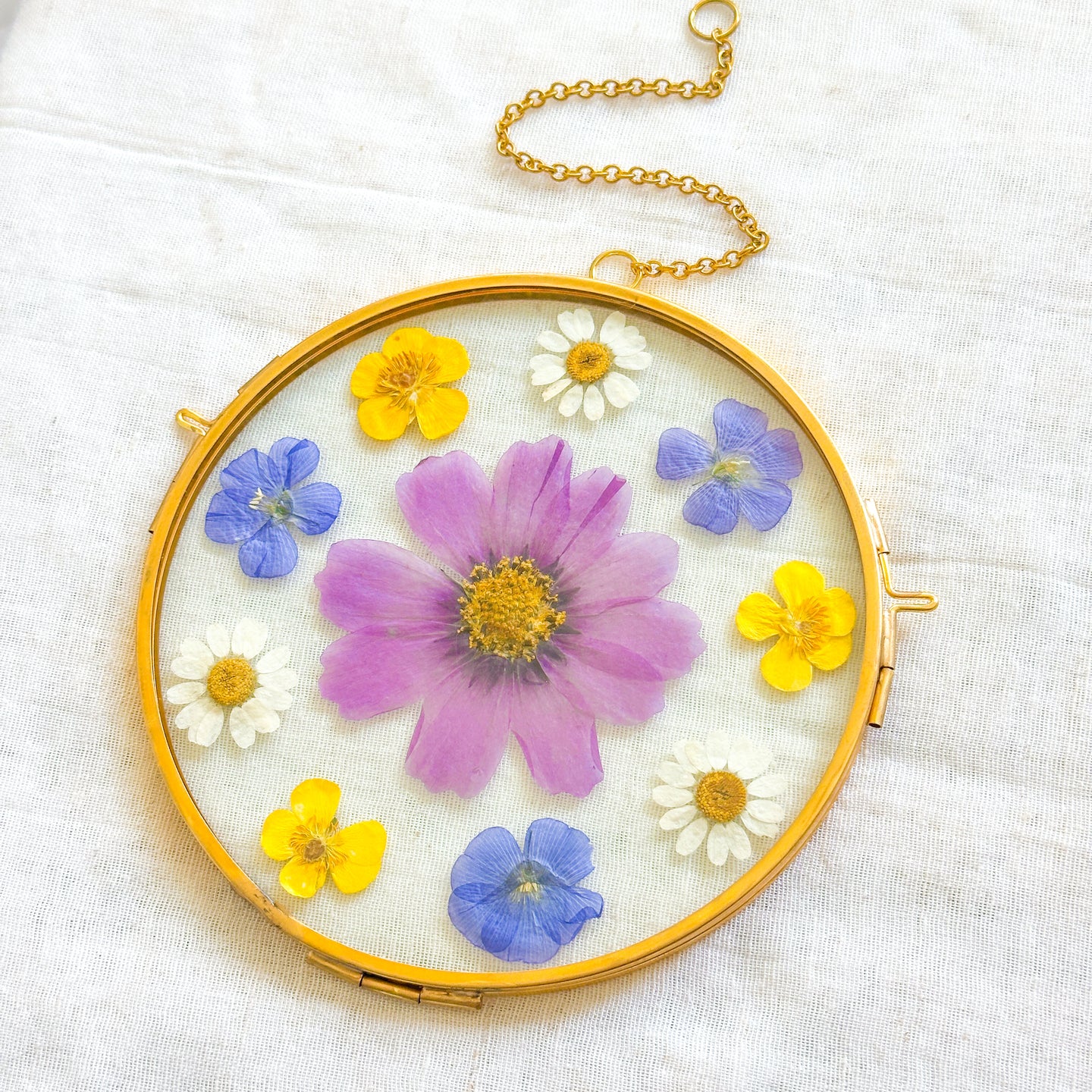 Cosmo, buttercup, daisy, & flax clock circle wall hanging