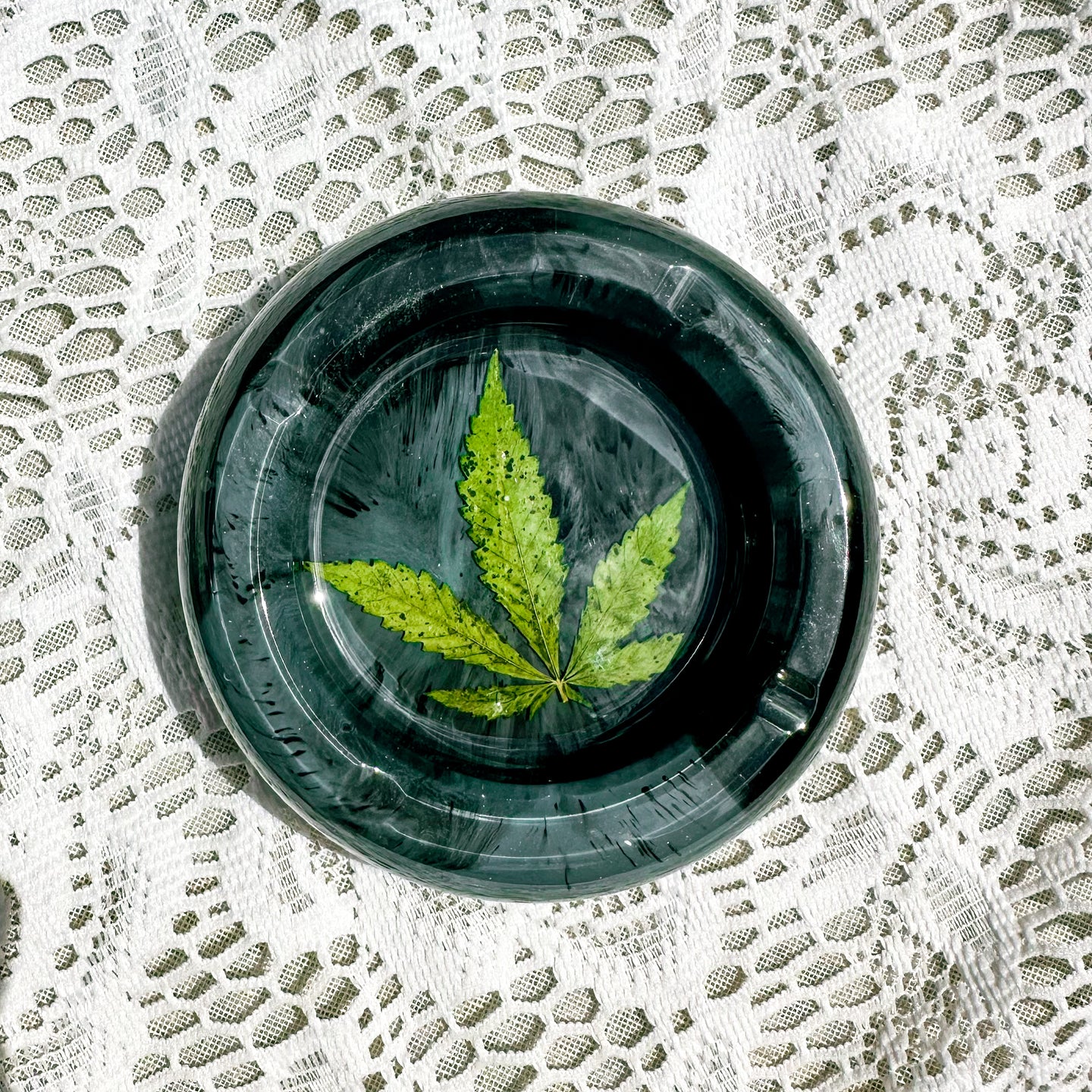 Green and black cannabis leaf round ashtray