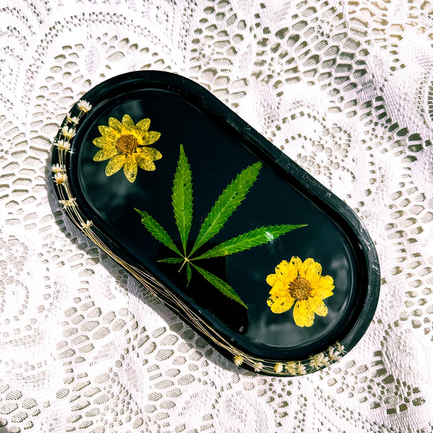 Oval goldeneye and cannabis leaf black tray