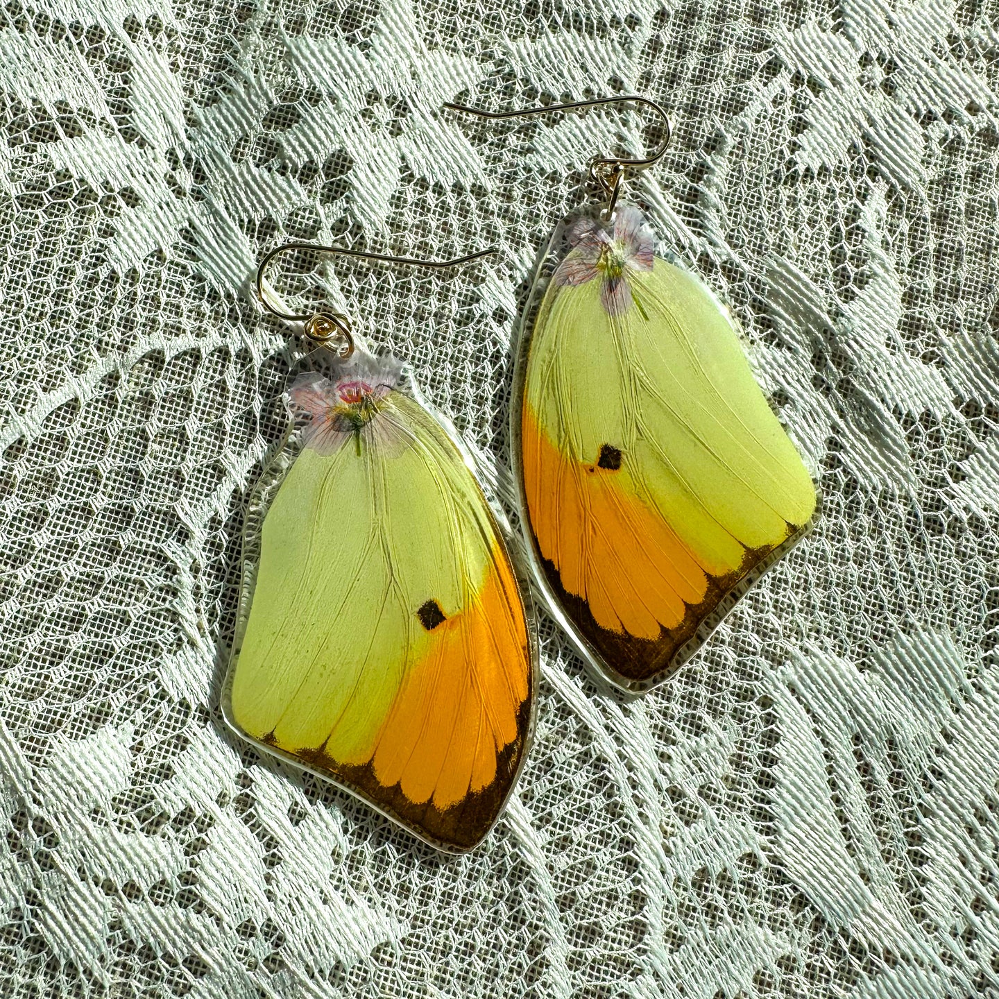 Purple flower yellow and orange wing earring